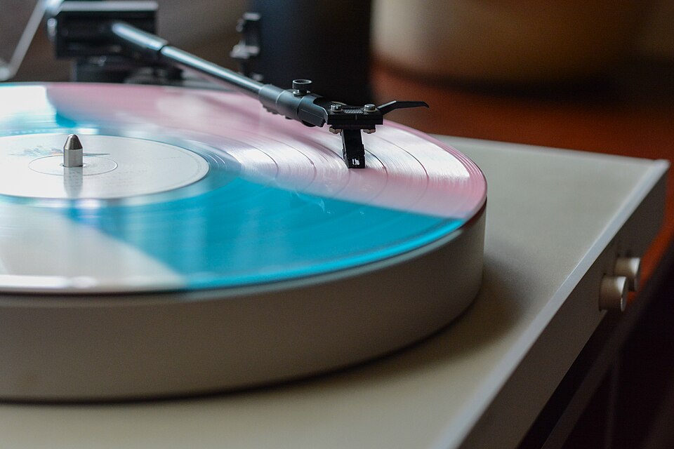 Turntable playing a coloured vinyl record