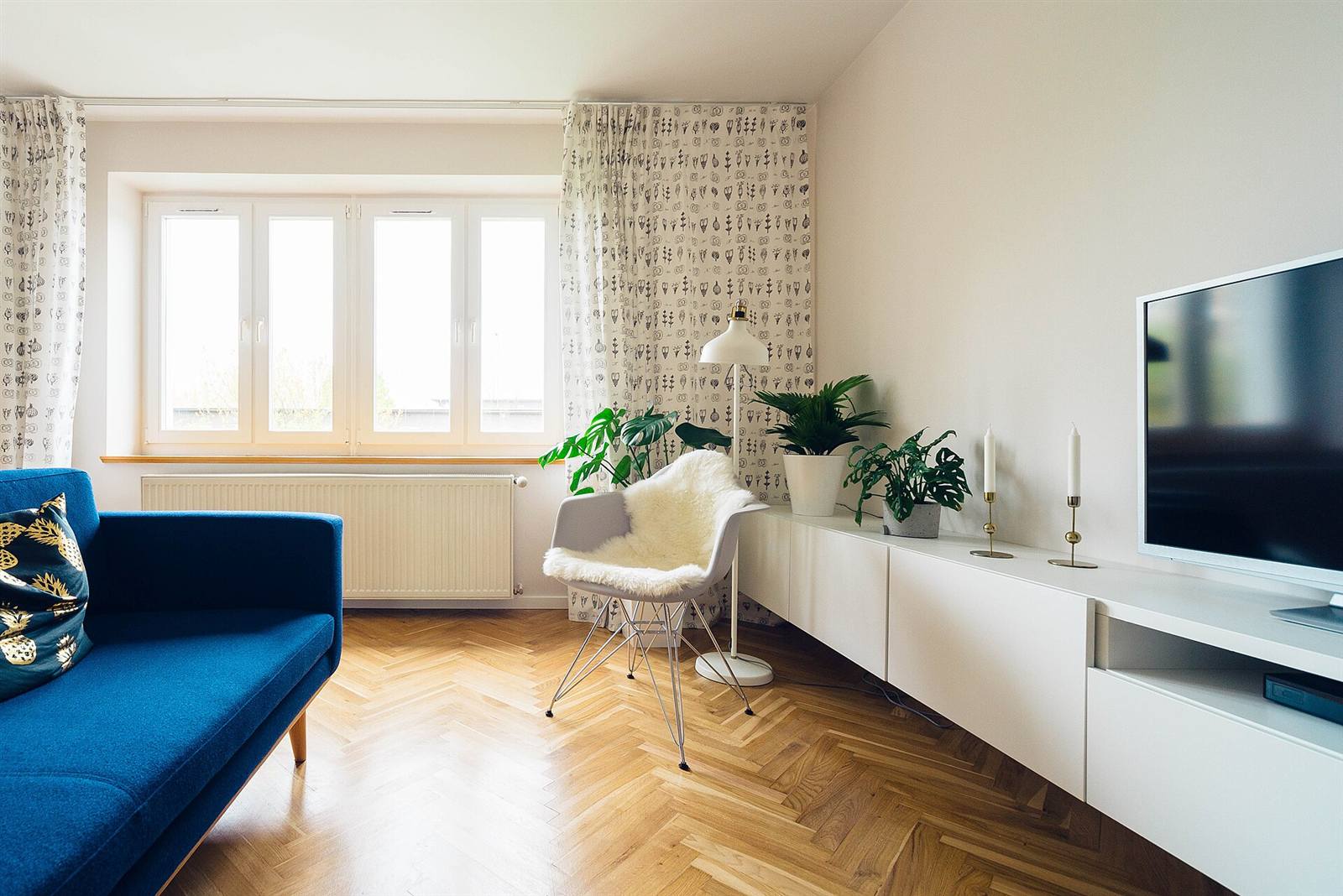 Flat-screen television in a bright living room